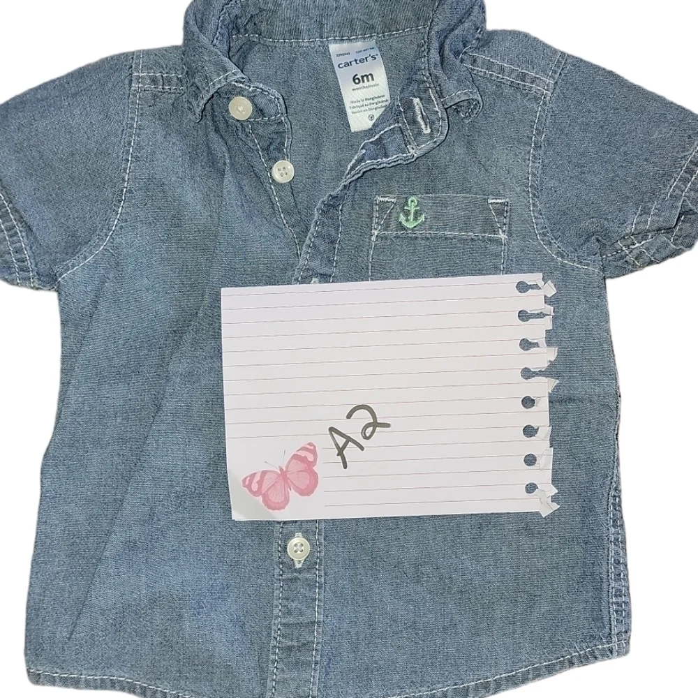 Carter’s size 6 months denim short sleeve shirt